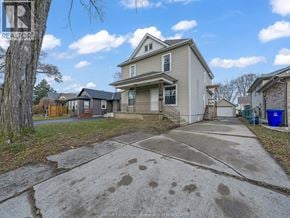 Windsor apartment for rent - A house with a driveway in front of it.