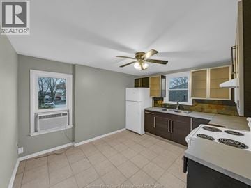 Windsor apartment for rent - A kitchen with a white refrigerator and a fan on the ceiling.