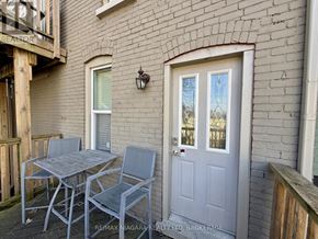 Niagara Falls (Downtown) duplex for rent - A patio with a table and chairs is shown.
