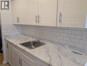 Burlington apartment for rent - A kitchen with a sink and cabinets.