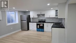 London East (East D) apartment for rent - A kitchen with a refrigerator, oven, and cabinets.