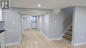 London East (East D) apartment for rent - A hallway with a staircase leading to the second floor.