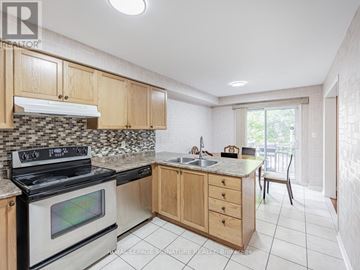 Mississauga (East Credit) townhouse for rent - A kitchen with a stove top oven and a counter top.