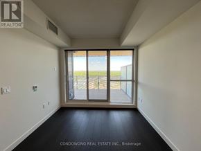 Toronto (Bayview Village) condo for rent - A room with a sliding glass door leading to a balcony.