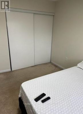 Oshawa (Taunton) apartment for rent - A bedroom with a bed and a closet.