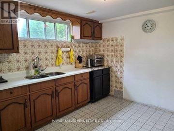 Mississauga (Cooksville) apartment for rent - A kitchen with wooden cabinets and a clock on the wall.