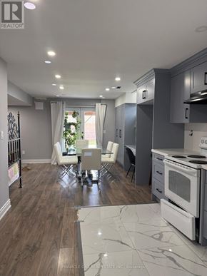 Clarington (Bowmanville) apartment for rent - A modern kitchen with a dining table and chairs.