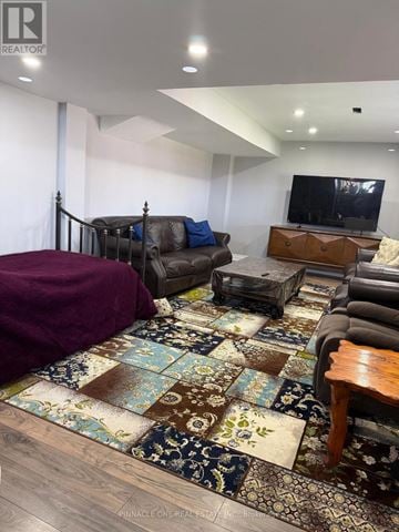 Clarington (Bowmanville) apartment for rent - A living room with a brown sofa and a rug.