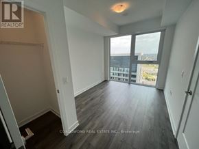 Richmond Hill (Langstaff) condo for rent - A room with a sliding glass door leading to a balcony.
