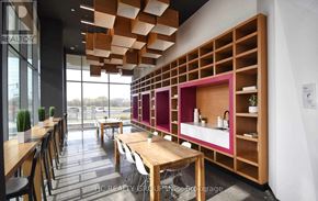 Markham (Unionville) condo for rent - A modern dining area with wooden tables and chairs.