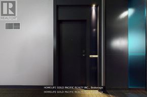 Toronto (Bay Street Corridor) condo for rent - A black door with a glass window and a sign on the wall.