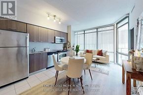 Toronto (Bay Street Corridor) condo for rent - A modern kitchen with a dining table set up.