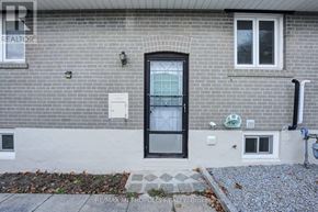 Newmarket (Bristol-London) apartment for rent - A grey brick house with a black door and windows.