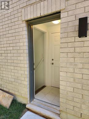 Caledon apartment for rent - A door is open to a white interior.