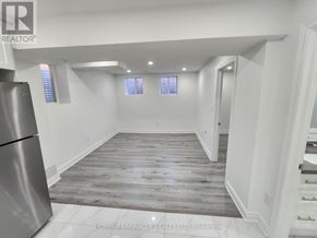 Caledon apartment for rent - A spacious room with wooden flooring and white walls.