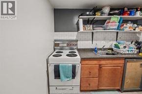 Windsor apartment for rent - A kitchen with a stove top oven and a sink.