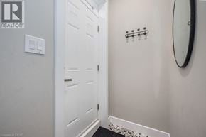 Kitchener apartment for rent - A white door with a mirror above it.