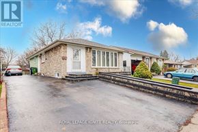 Toronto (Malvern) apartment for rent - A house with a car parked in front of it.