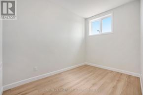 North Stormont multi-family for rent - A room with a window and wooden flooring.