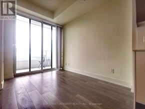 Toronto (Don Valley Village) condo for rent - A room with a sliding glass door and wooden flooring.