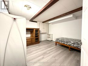 Toronto (L'amoreaux) apartment for rent - A bedroom with a bed, dresser, and wardrobe.