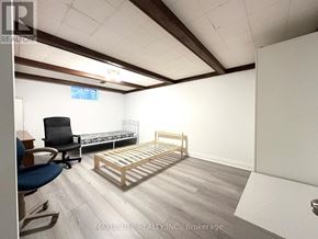 Toronto (L'amoreaux) apartment for rent - A bedroom with a bed, chair, and desk.