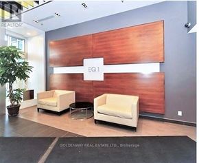 Toronto (Bendale) condo for rent - A waiting area with two chairs and a table in front of a wood panelled wall.