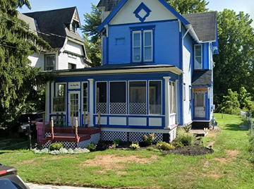 Mansfield apartment for rent - A blue house with white trim and a black roof.