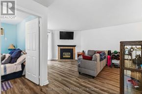 London East (East L) condo for rent - A living room with a fireplace and a grey couch.