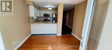 Pickering (Amberlea) apartment for rent - A realtor photo of a kitchen and living room.