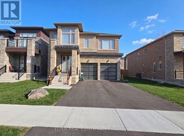 East Gwillimbury (Holland Landing) apartment for rent - A large house with a driveway in front of it.