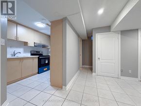 Markham (Middlefield) apartment for rent - A kitchen with white tiled floors and a white door.