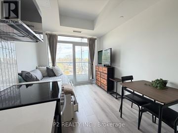 Toronto (Centennial Scarborough) condo for rent - A modern kitchen with a dining table and chairs.