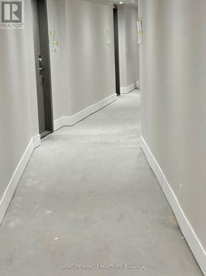 Clarington (Bowmanville) condo for rent - A hallway with a sign that says "REALTOR".