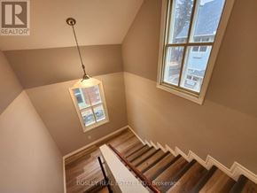 Markham (Wismer) apartment for rent - A staircase with a light hanging from the ceiling.