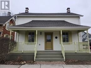 Markham (Wismer) apartment for rent - A white house with a green front porch.