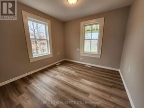 Markham (Wismer) apartment for rent - A room with wooden flooring and two windows.