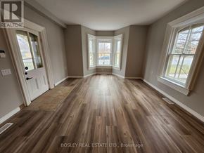 Markham (Wismer) apartment for rent - A room with wooden flooring and a large window.