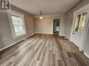 Markham (Wismer) apartment for rent - A room with wooden flooring and a ceiling light fixture.