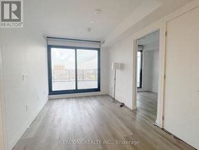 Hamilton (Beasley) condo for rent - A room with a large window and wooden flooring.