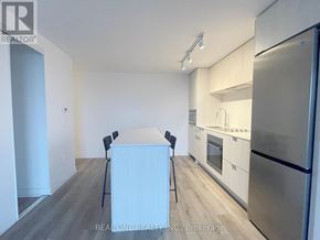 Hamilton (Beasley) condo for rent - A kitchen with a refrigerator, oven, and sink.
