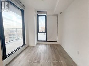Hamilton (Beasley) condo for rent - A room with a large window and a sliding door.