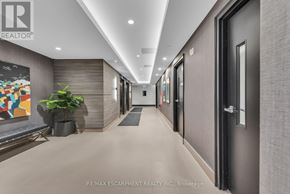 Milton (Walker) condo for rent - A hallway with a plant and a painting on the wall.