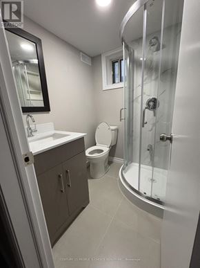 Toronto (Maple Leaf) apartment for rent - A bathroom with a toilet, sink, and shower.