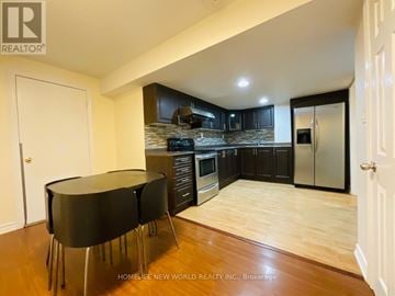 Markham (Cornell) apartment for rent - A modern kitchen with a black table and wooden floors.