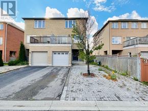 Markham (Cornell) apartment for rent - A real estate image of a house with a tree in front.