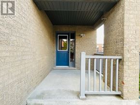 Markham (Cornell) apartment for rent - A blue door is on the left side of a brick wall.