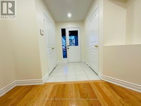 Markham (Cornell) apartment for rent - A hallway with a door at the end and a window above it.