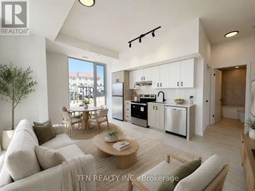 Burlington (Alton) condo for rent - A modern living room with a dining area and kitchen in the background.