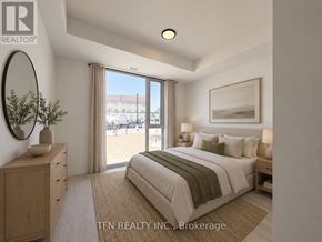 Burlington (Alton) condo for rent - A bedroom with a large bed, a wooden dresser, and a view of the street through the window.